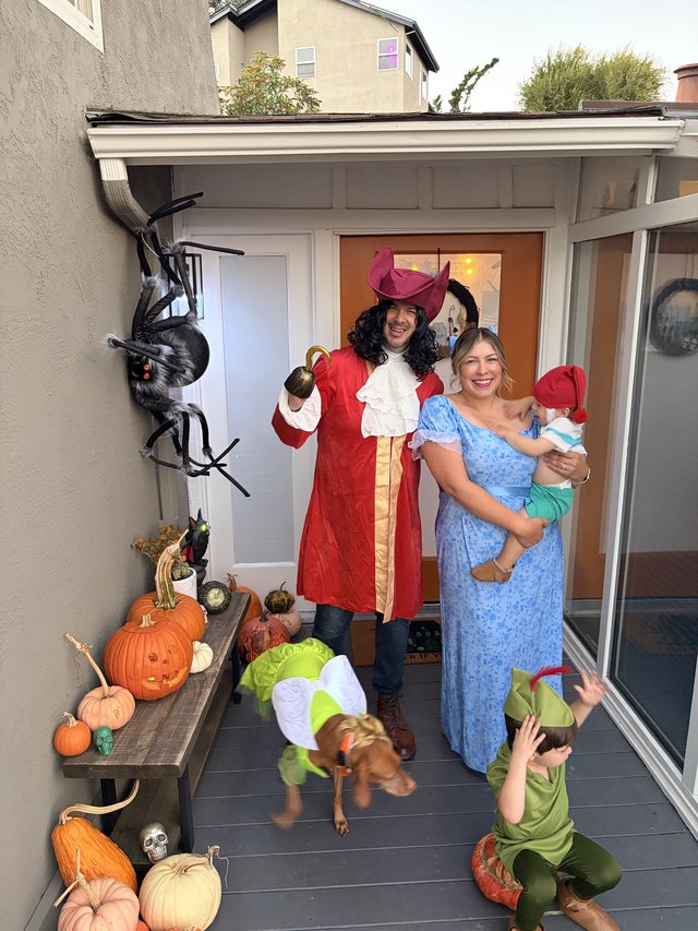 Family Peter Pan Halloween Costume at Decorated Porch