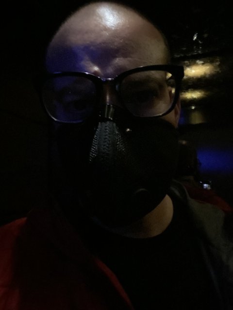 Masked man in the dark