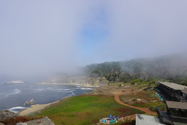 Spectacular Scenery of the Foggy Ocean from a Promontory