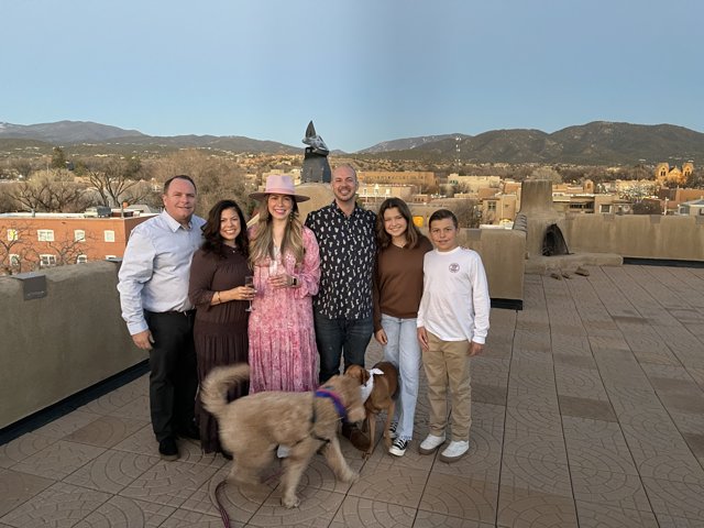 Family Portrait on the Rooftop with their Furry Friend