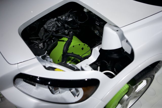 Under the Hood: A Look at the Engine Compartment of a Green Car