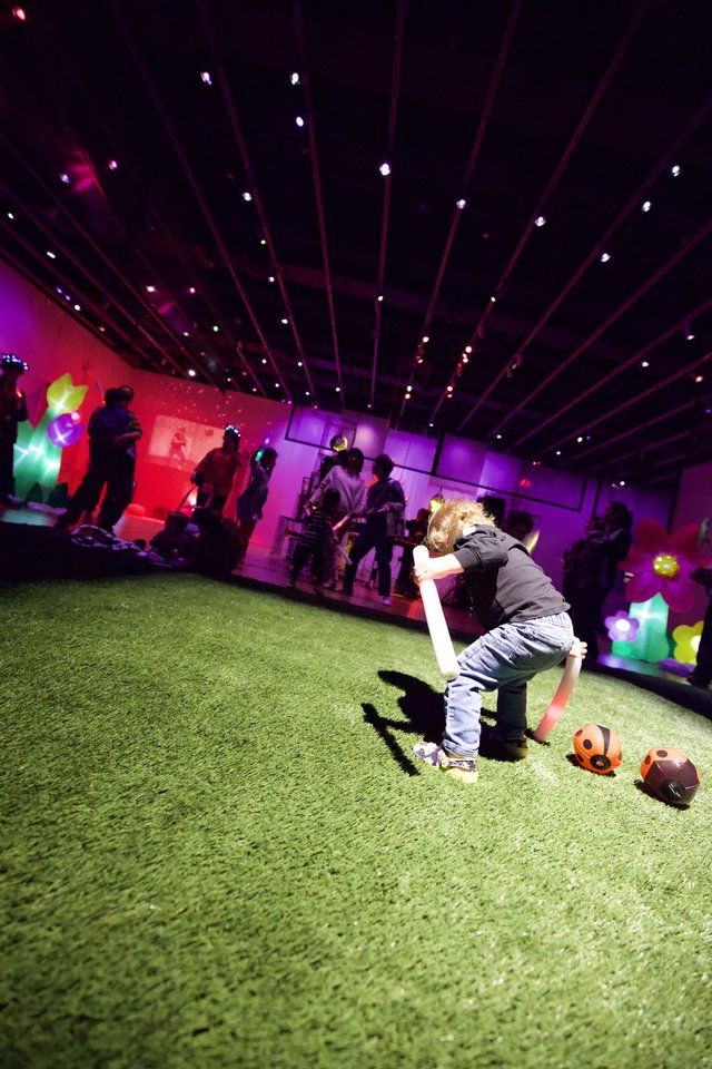 Child Playing at Baby Rave Event with Neon Lights