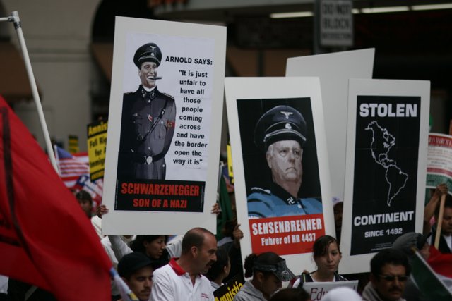 Student Protesters Hold Up Nazi Leaders' Posters
