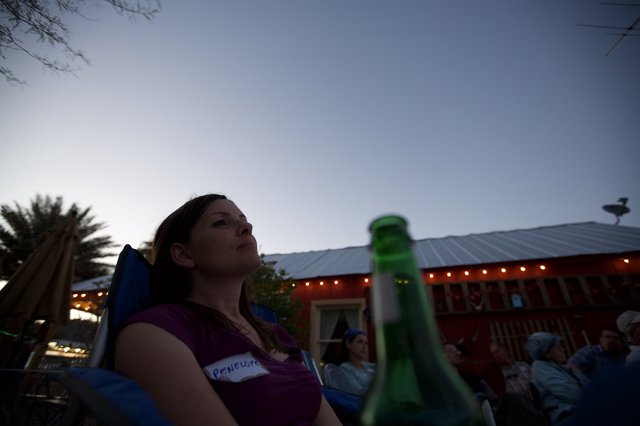 Penelope Gazes Skyward at Twilight Outdoor Gathering
