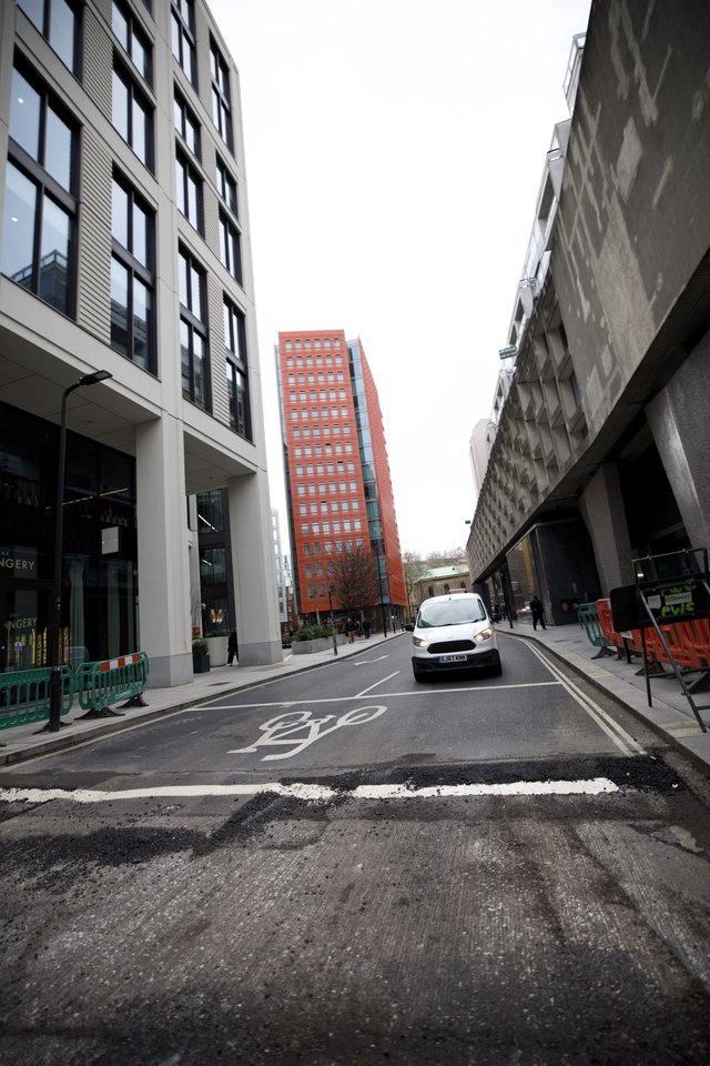 Modern Urban Street Scene with Red Brick Tower