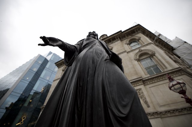 Monumental Bronze Statue Against Historic London Architecture