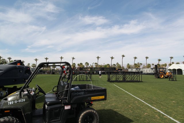 Parked Golf Cart on a Green Field