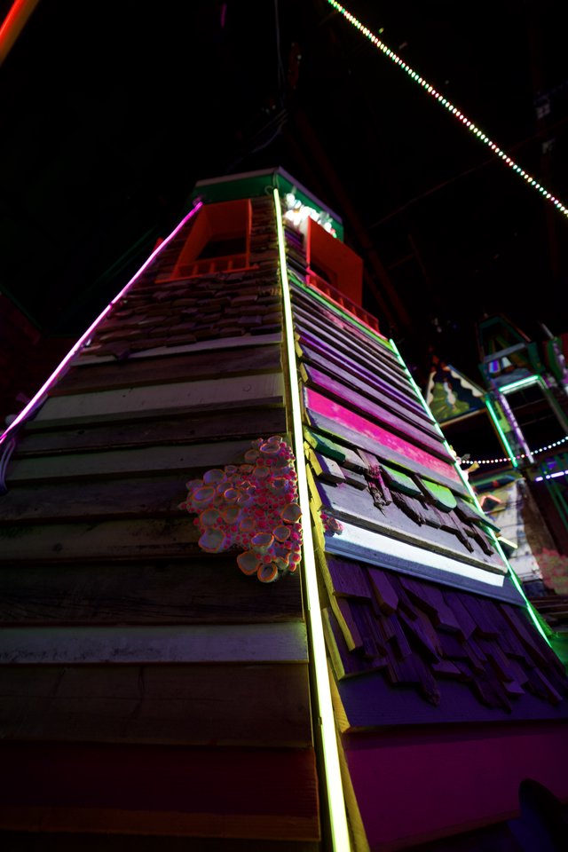 Neon-Lit Tower at Night Amusement Ride