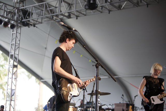 Sharin Foo performs on stage with guitar at Coachella 2010
