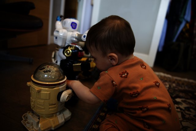 Adorable Baby Discovers the World of Robotics
