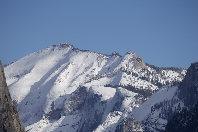Snow-Covered Mountain Peaks in Winter Sunlight