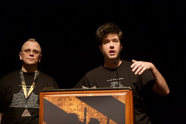 Two Men Deliver Speech at DefCon Conference