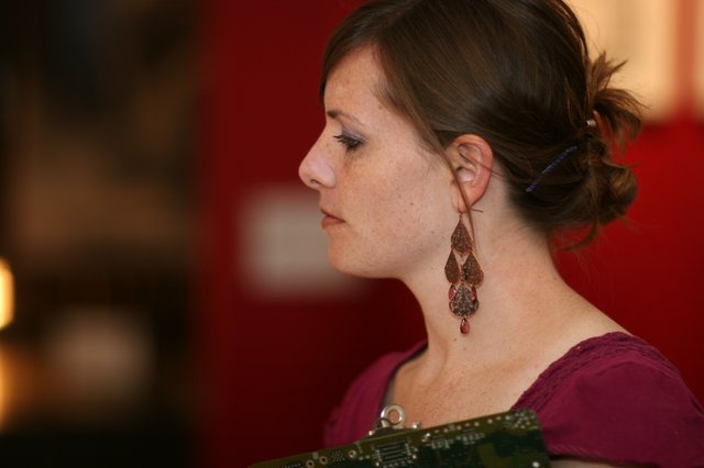 Contemplative Woman in Profile at Art Walk