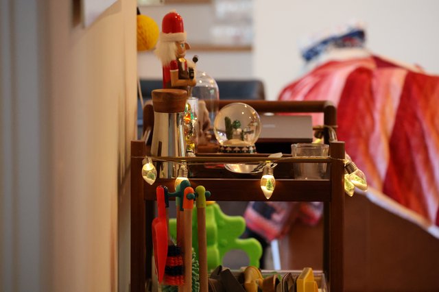 Festive Holiday Display on Wooden Cart with Toys