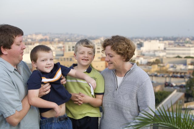 Family Portrait on Urban Rooftop Overlooking City