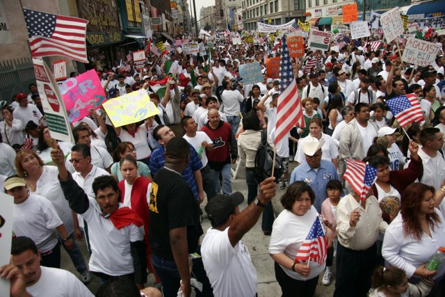 Proud Americans Marching With Flags and Signs