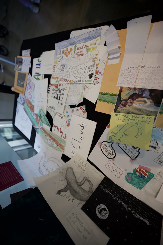 Memorial Display Board Covered with Children's Drawings and Notes