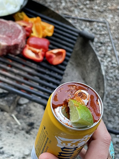 Grilling up a Pork Feast with a Cold Beer