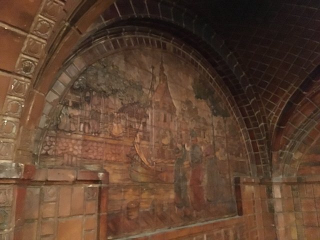 The Crypt Mural on an Ancient Brick Wall
