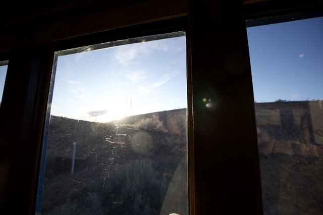 Sunset Through Dusty Windows in Abandoned Building