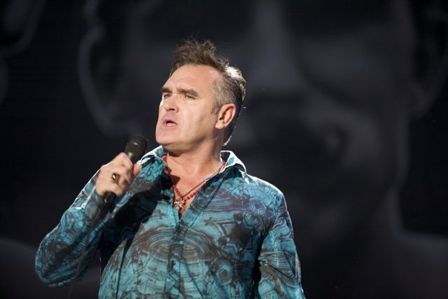 Morrissey Takes Center Stage with Microphone in Hand