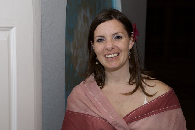 Radiant Woman in Pink Shawl at Wedding Celebration
