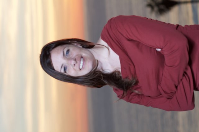 Woman in Red at Golden Hour Seaside Portrait
