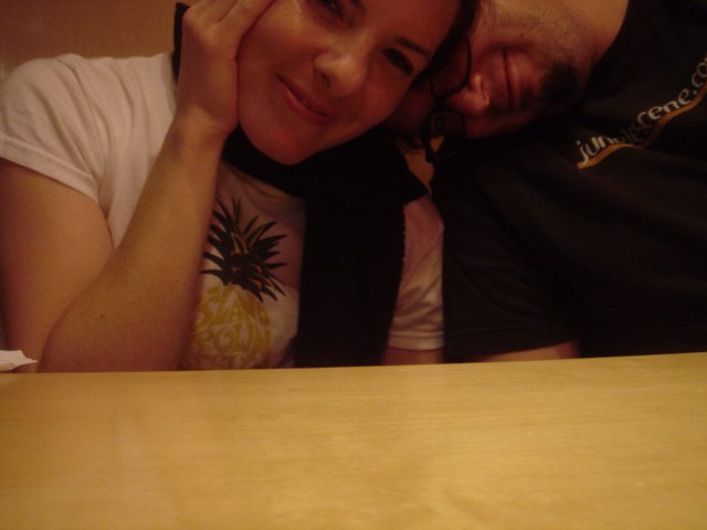 Couple Leaning Together at Table Late Night
