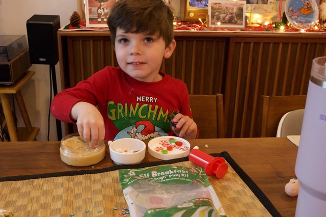 Young Boy Making Elf Breakfast on Christmas Eve