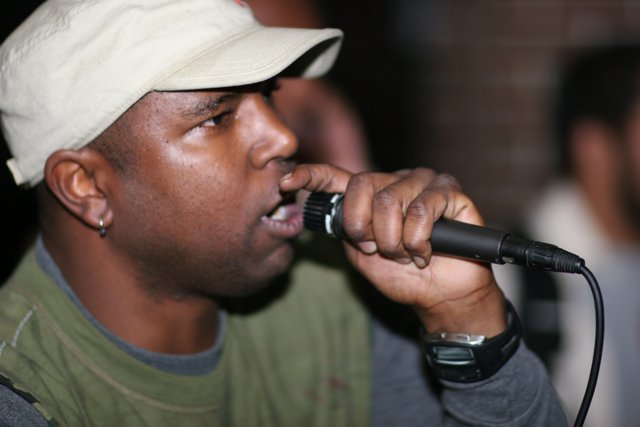 Steve J performs with a cap
