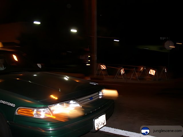 Green Coupe Racing Through the Night