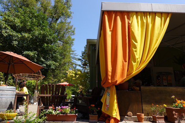 Colorful Outdoor Patio with Orange Yellow Curtains