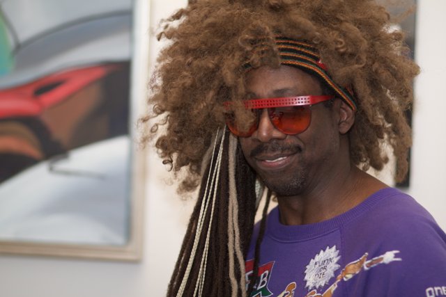 The Happy Man with Dreads and Sunglasses