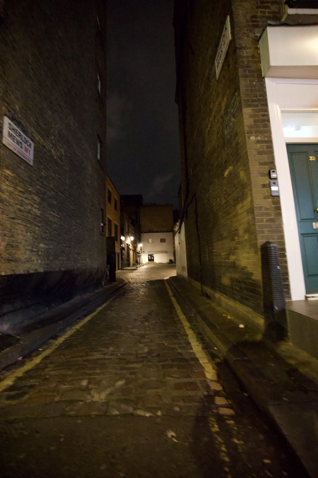 Atmospheric Night View of Narrow London Alleyway