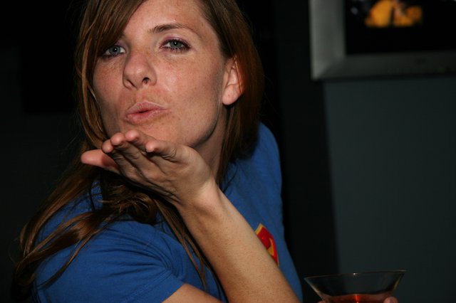 Penelope Blowing a Playful Kiss at Party