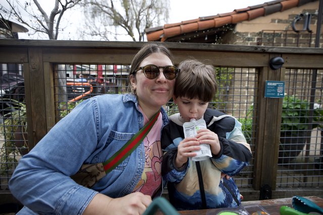Mother and Son Enjoying Outdoor Refreshment Together