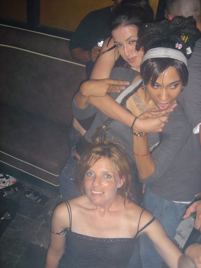 Three Women Posing at a Nightclub Party 2004