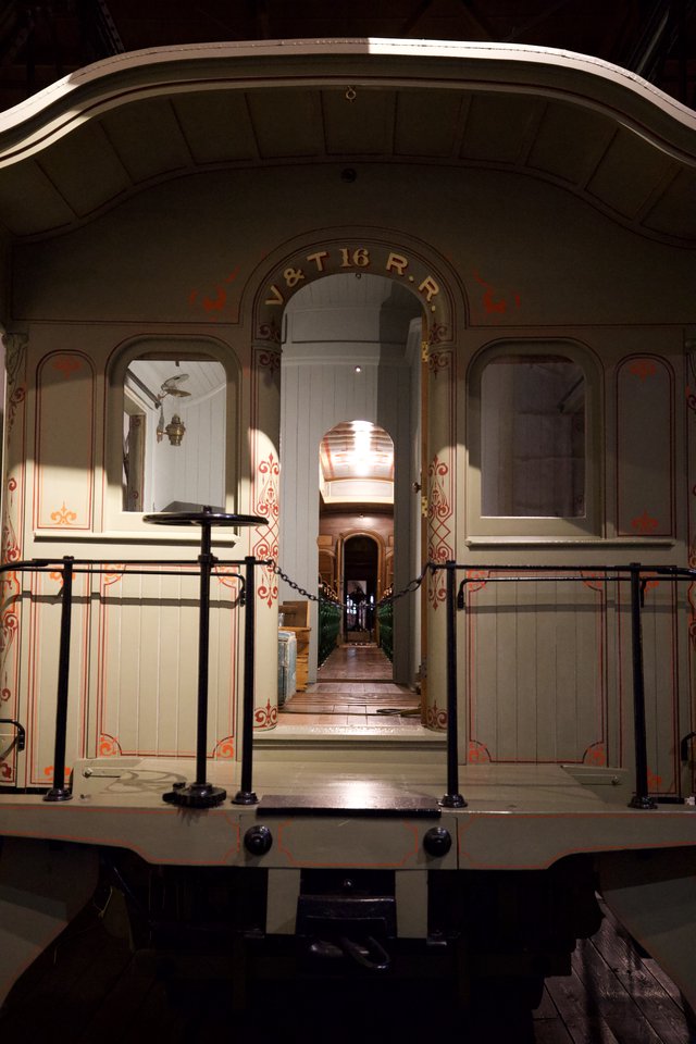 Historic Railway Car Interior with Ornate Decorative Detailing