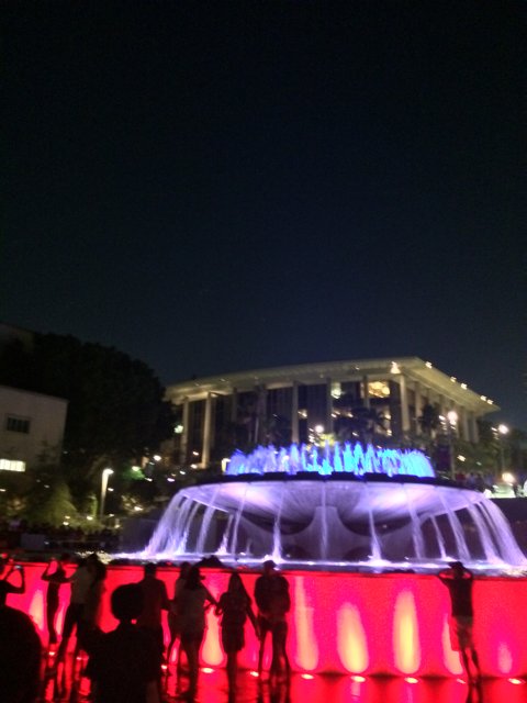 Nighttime Gathering Around Civic Center Mall's Fountain