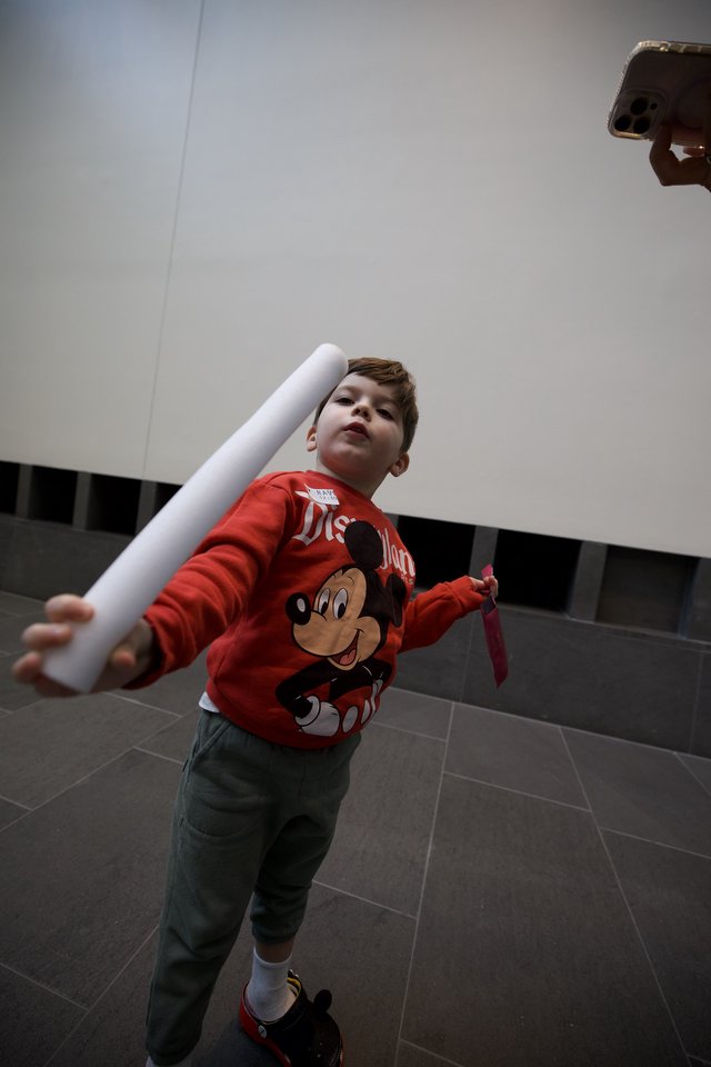 Young Boy Playing with Paper Tube at Asian Art Museum