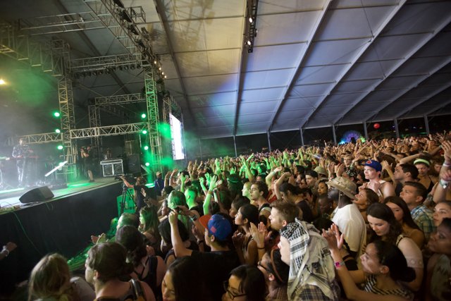 Green-lit Crowd at Coachella Concert