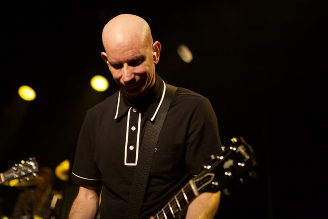 Bald Guitarist Shreds On Stage