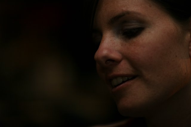 Penelope's Quiet Smile in Dramatic Low Light