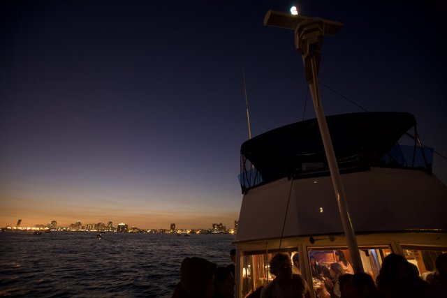 Nighttime Boat Ride with Cityscape