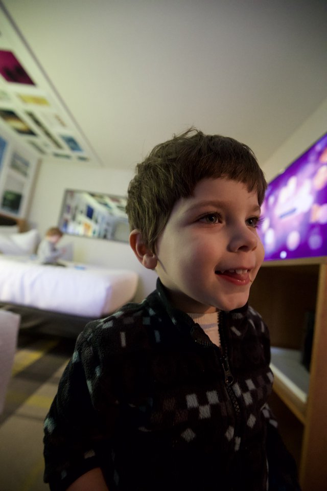 Young Boy's Joyful Evening Portrait at Home