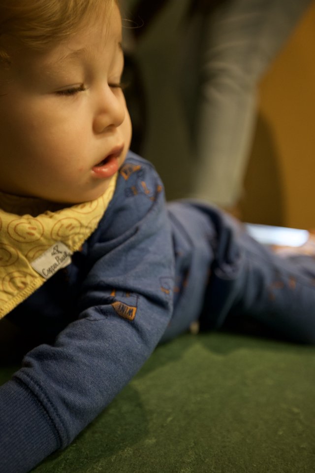 Young Child in Quiet Contemplation at Indoor Setting