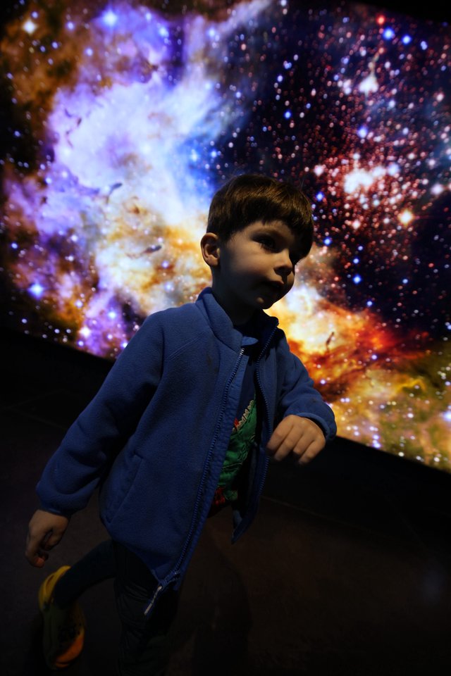 Young Explorer at Cosmic Nebula Display