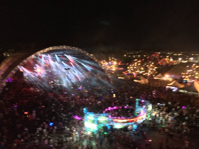 Lights and Pyrotechnics Illuminate Nighttime Crowd