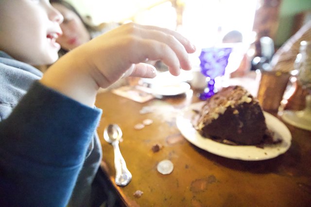 Child Enjoying Chocolate Cake at Madonna Inn