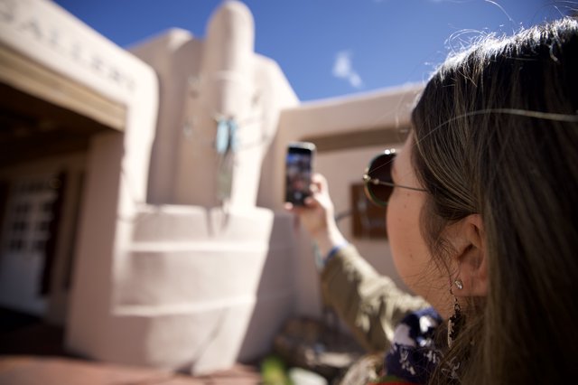 Tourist Photographing Adobe Architecture in Santa Fe